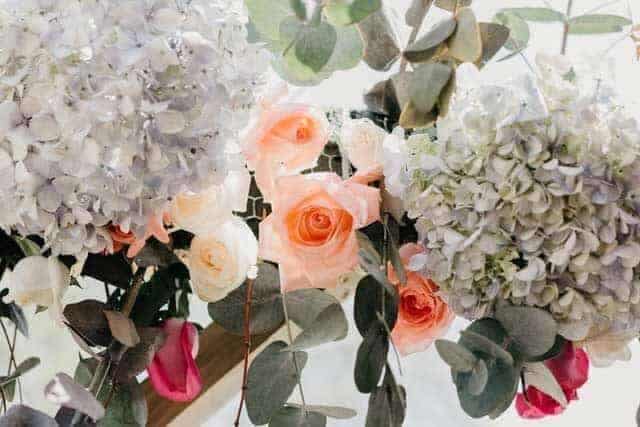 Orange, white, and red flower arrangement