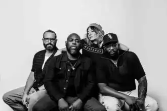 Diverse group of friends sitting together, showcasing LGBTQ+ pride and unity in black and white.