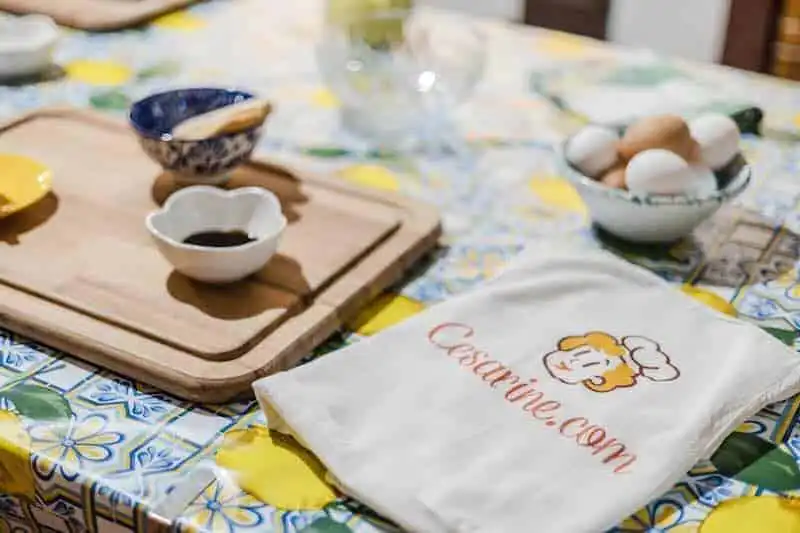 Kitchen utensils for cooking and baking on a colorful table.