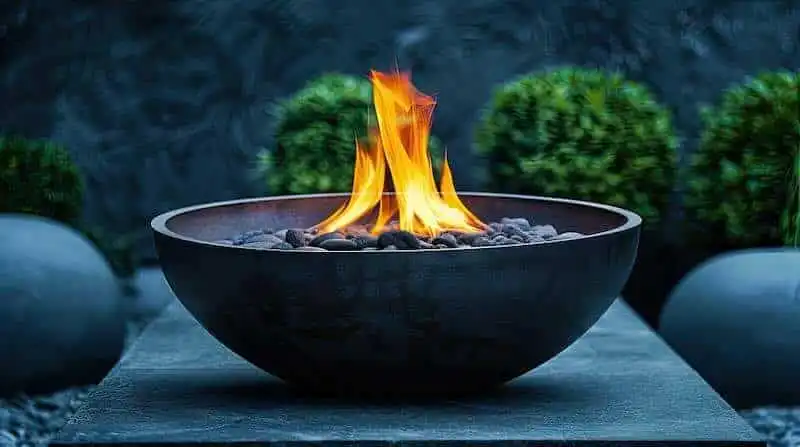 Stylish outdoor firepit with flames and decorative stones, perfect for outdoor entertainment.