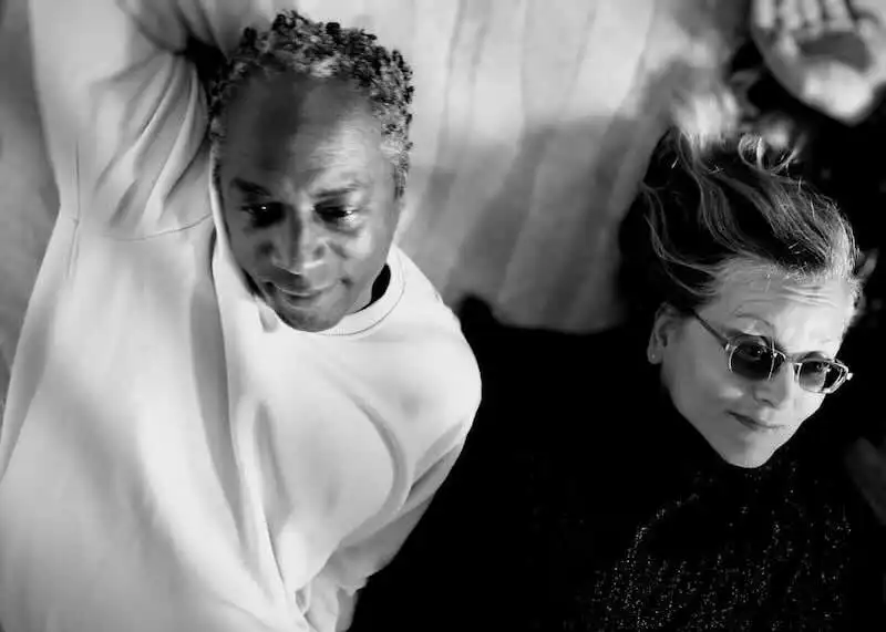 Close-up of two women lying together, showcasing friendship and acceptance.