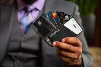 Credit card wallet with multiple bank cards and a smartphone, symbolizing digital payment and financial management.