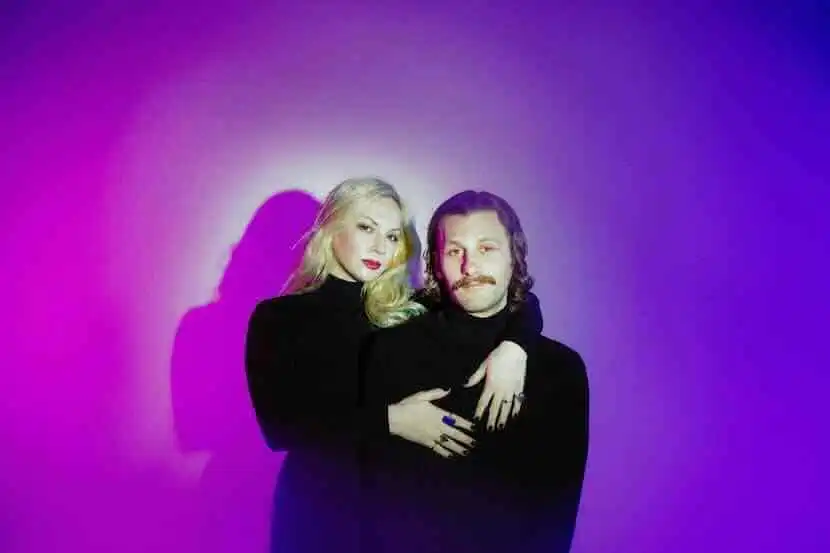 Beautiful LGBTQ couple with confident expressions.