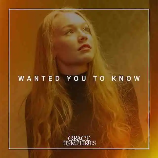 Dark-haired woman with thoughtful expression in warm-toned portrait for Divine Magazine.