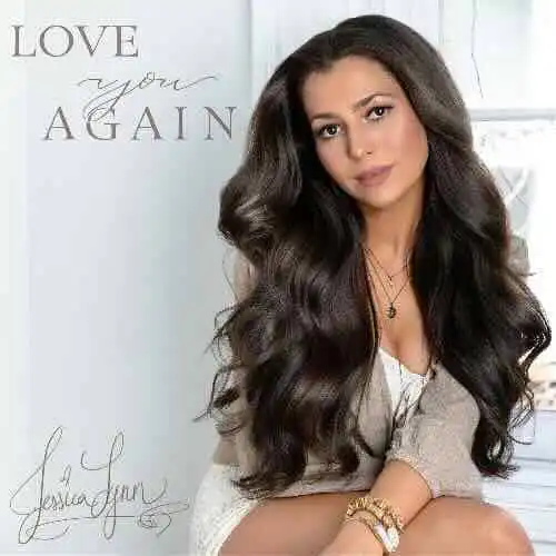 Beautiful woman with long dark hair, soft expression, in an elegant setting.