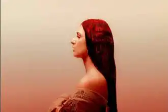 Elegant woman with long, dark hair in profile shot.