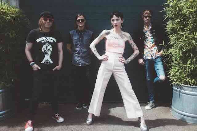 LGBTQ+ group photo featuring diverse styles at Divine Magazine event, celebrating inclusivity and pride.