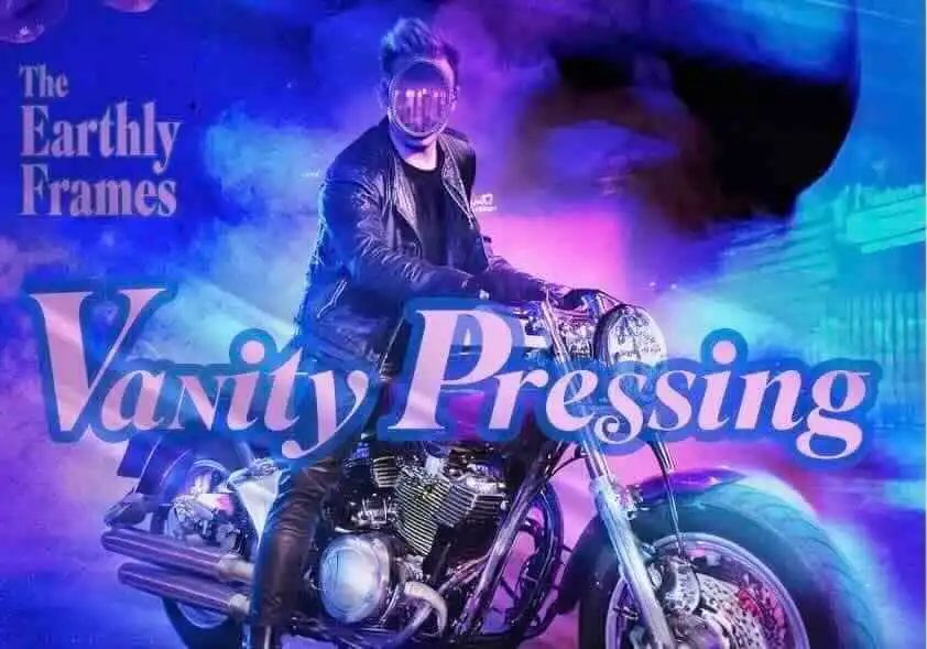 A person in leather jacket riding a motorcycle with vibrant neon lighting.