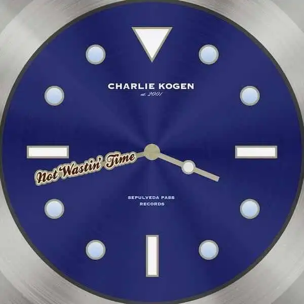 Close-up of a blue record clock with "Not Wastin Time" label and Charlie Kogen.