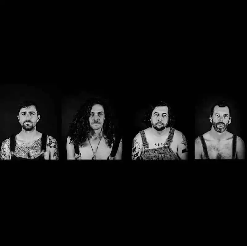 Black-and-white portraits of diverse LGBTQ+ men showcasing confidence and authenticity.