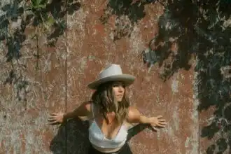 Beautiful woman in hat resting outdoors.