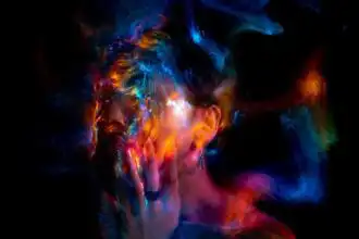 Colorful abstract artistic portrait with vibrant lights and creative effects of a woman.