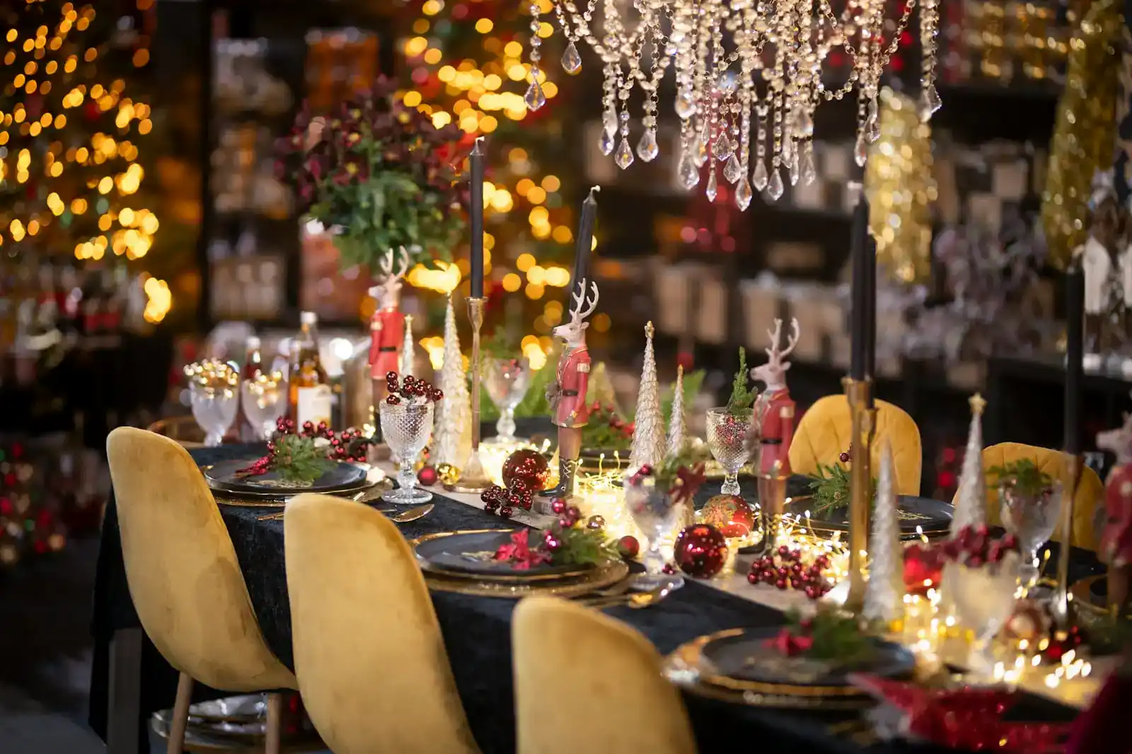 Festive holiday table setting with golden chairs and lights