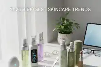 Futuristic skincare bottles on a marble counter showing 2026 trends like personalized serums and microbiome creams.