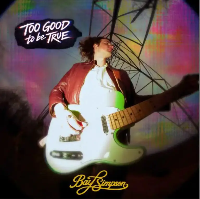 Bay Simpson – Too Good to Be True Bay Simpson performing with guitar at a concert, vibrant stage background.