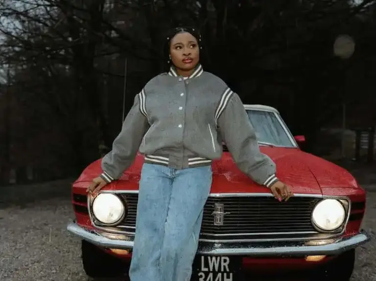 Brenique Adams – Oasis EP & New Single “Light” Brenique Adams standing in front of a vintage red car, promoting her Oasis EP and new single "Light.
