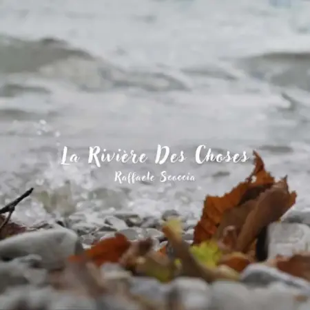 Raffaele Scoccia – La Rivière Des Choses: Time, Memory & Motion Peaceful river with fallen leaves and smooth stones in the foreground.