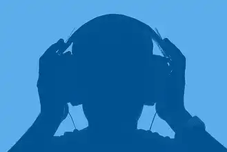 Headphones user enjoying music, silhouette of a person listening to audio.