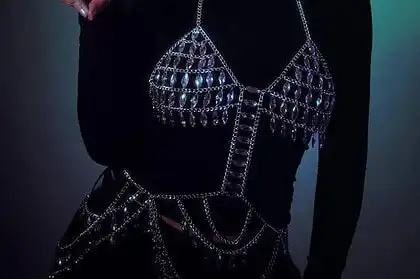 JULITH wearing a furry hat and stylish jewelry, promoting her debut EP.