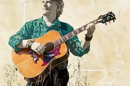 Todd Mosby playing guitar outdoors in a natural setting, promoting slow living and American heartlan.