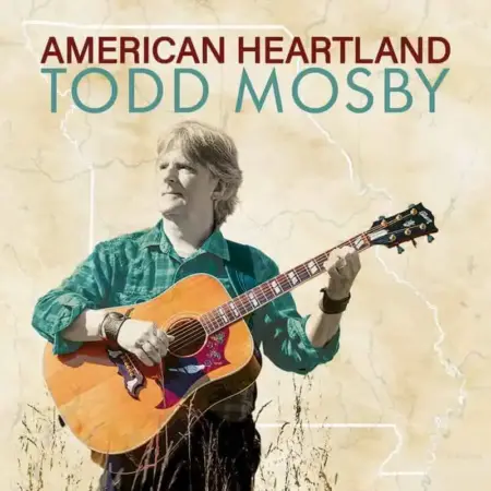 Todd Mosby: American Heartland | Finding Space in Slow Living Todd Mosby playing guitar outdoors in a natural setting, promoting slow living and American heartlan.