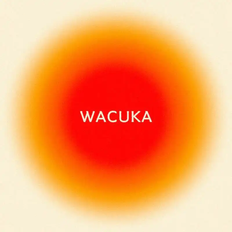 Vivid red-orange blurred background with "WACUKA" text overlay, creative design for divine magazine features.